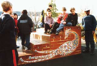 completed mosaic on  playground wall.